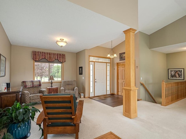 9368 188th Ave NW, Nowthen, MN 55330 - carpeted living room featuring a chandelier and ornate columns