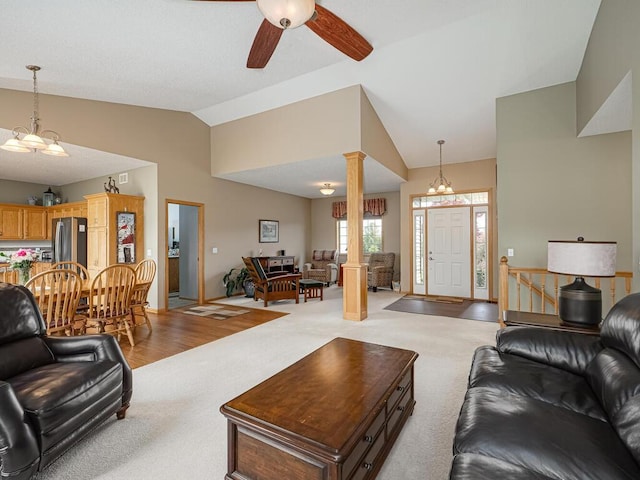 9368 188th Ave NW, Nowthen, MN 55330 - living area with lofted ceiling, light colored carpet, ornate columns, and a ceiling fan