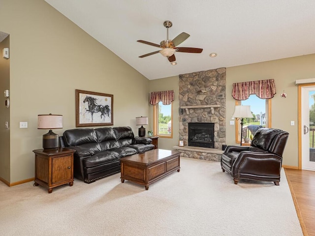 9368 188th Ave NW, Nowthen, MN 55330 - living area featuring ceiling fan, a fireplace, light colored carpet, and high vaulted ceiling