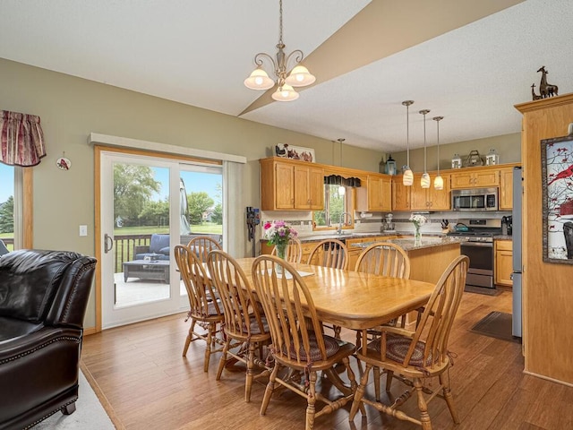 9368 188th Ave NW, Nowthen, MN 55330 - dining area featuring a chandelier and light wood-style floors