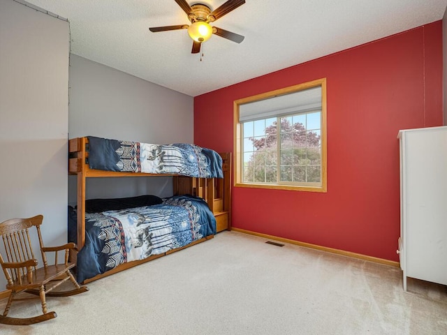 9368 188th Ave NW, Nowthen, MN 55330 - carpeted bedroom with a ceiling fan and baseboards