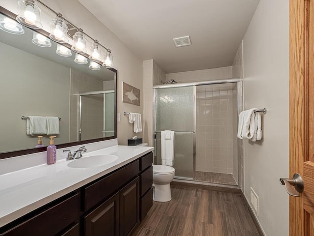 9368 188th Ave NW, Nowthen, MN 55330 - full bath featuring vanity, a shower stall, and wood finished floors