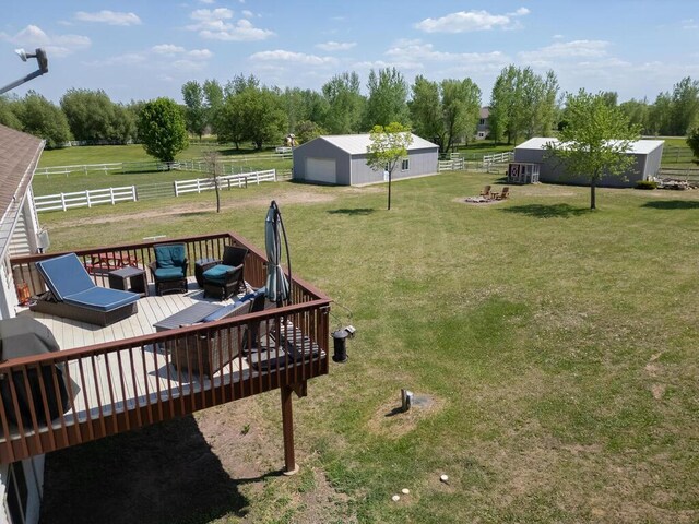 9368 188th Ave NW, Nowthen, MN 55330 - view of yard with a pole building, an outdoor structure, a wooden deck, an outdoor living space, and view of scattered trees