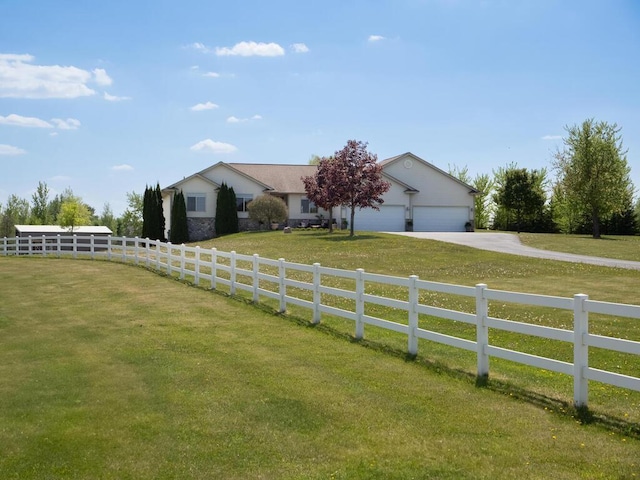 9368 188th Ave NW, Nowthen, MN 55330 - view of front of home featuring concrete driveway, a fenced front yard, and an attached garage