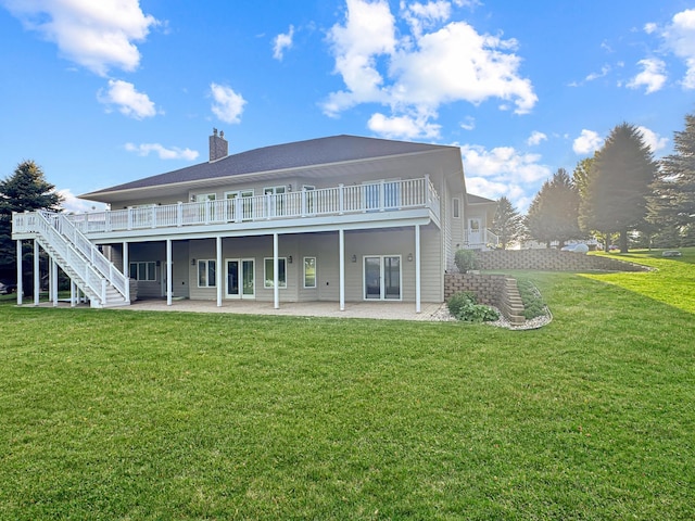 16 Pheasant Dr, Mason Twp, MN 56172 - rear view of house featuring a patio area, a yard, a chimney, stairs, and a wooden deck