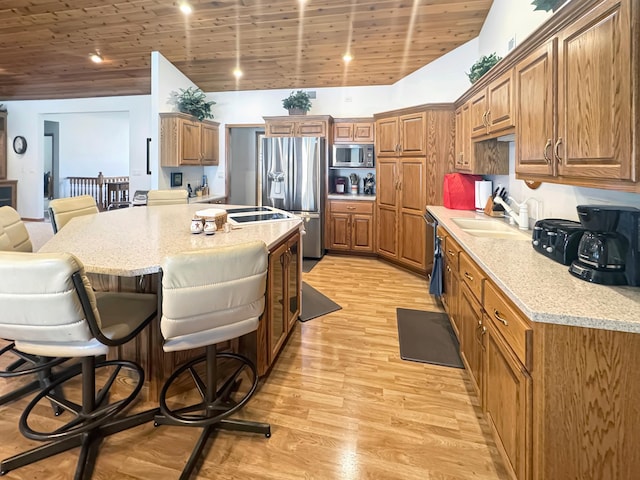 16 Pheasant Dr, Mason Twp, MN 56172 - kitchen with stainless steel appliances, a sink, a breakfast bar area, brown cabinetry, and wooden ceiling