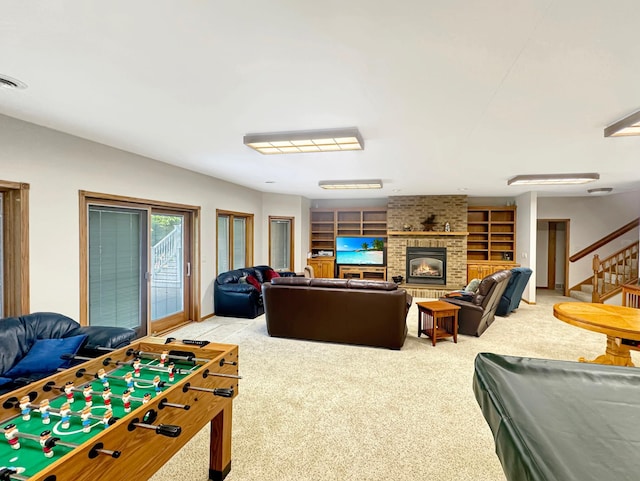 16 Pheasant Dr, Mason Twp, MN 56172 - game room featuring light colored carpet, built in features, a fireplace, and baseboards