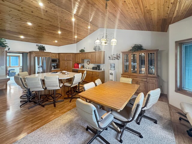 16 Pheasant Dr, Mason Twp, MN 56172 - dining area with a chandelier, wood ceiling, light wood-style flooring, lofted ceiling, and recessed lighting
