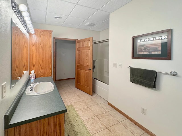 16 Pheasant Dr, Mason Twp, MN 56172 - full bath featuring vanity, a drop ceiling, shower / bath combination with glass door, tile patterned floors, and baseboards