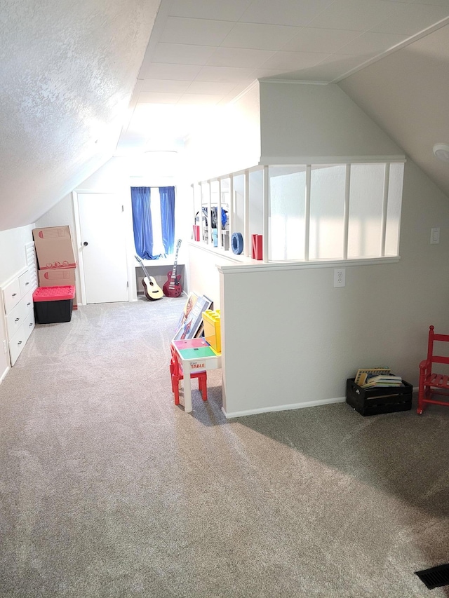 802 19th St SW, Austin, MN 55912 - playroom featuring lofted ceiling, carpet flooring, and baseboards