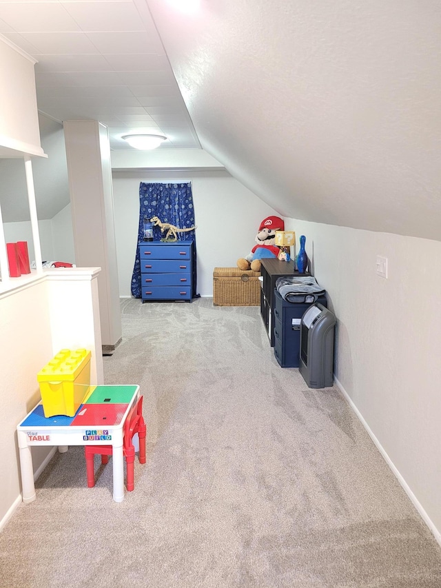 802 19th St SW, Austin, MN 55912 - game room with carpet, vaulted ceiling, and baseboards