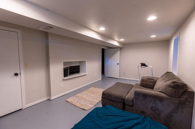 802 19th St SW, Austin, MN 55912 - living area with recessed lighting, finished concrete floors, and baseboards