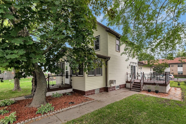 215 Main St E, Freeport, MN 56331 - view of home's exterior featuring a deck and a yard
