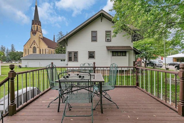 215 Main St E, Freeport, MN 56331 - deck featuring a lawn and outdoor dining space