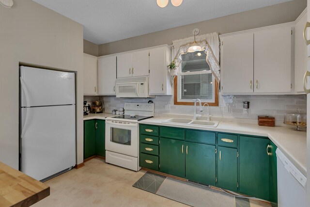 215 Main St E, Freeport, MN 56331 - kitchen featuring white appliances, a sink, white cabinetry, and decorative backsplash