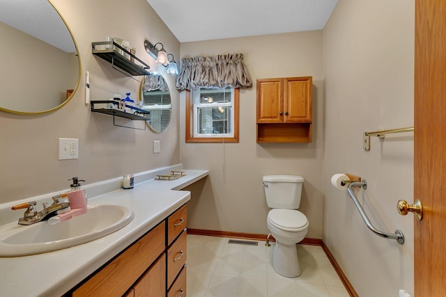 215 Main St E, Freeport, MN 56331 - bathroom with toilet, vanity, and baseboards