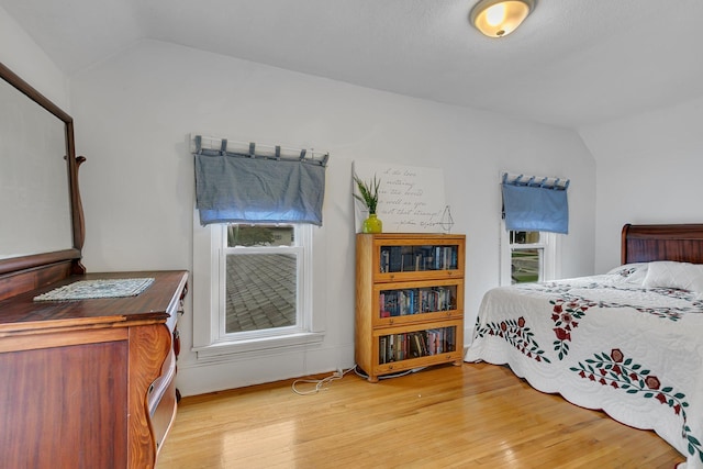215 Main St E, Freeport, MN 56331 - bedroom with vaulted ceiling and light wood-type flooring