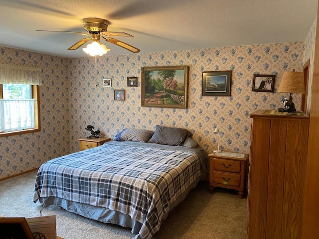 6563 Sandy Ln, Biwabik Twp, MN 55741 - carpeted bedroom with wallpapered walls and a ceiling fan
