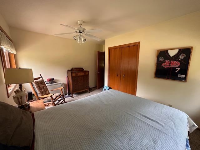6563 Sandy Ln, Biwabik Twp, MN 55741 - bedroom with a closet, ceiling fan, and carpet floors