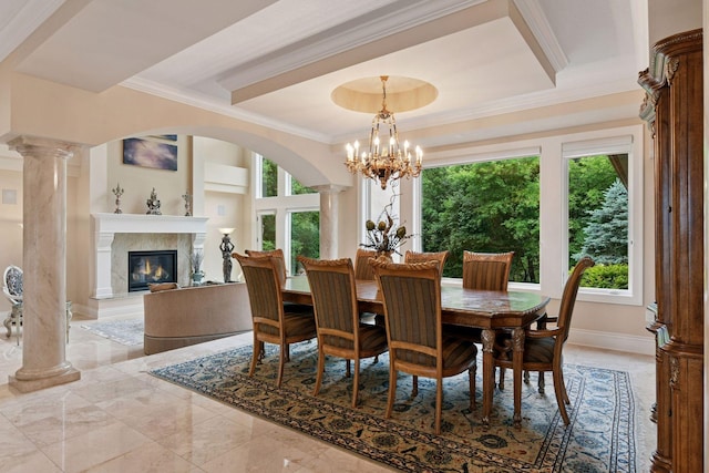 1910 Shoreline Dr, Orono, MN 55391 - dining area with crown molding, a premium fireplace, ornate columns, a chandelier, and a raised ceiling