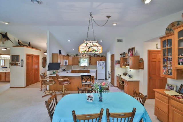 909 Lilac Ln, Little Falls, MN 56345 - dining room with vaulted ceiling and light colored carpet