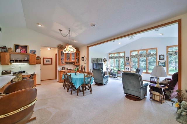 909 Lilac Ln, Little Falls, MN 56345 - dining room with vaulted ceiling and light carpet