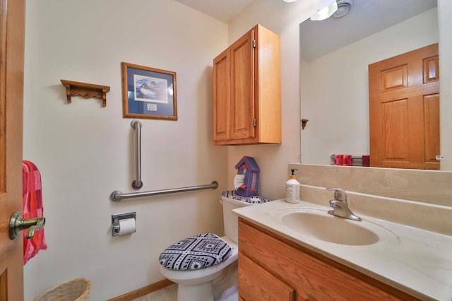 909 Lilac Ln, Little Falls, MN 56345 - bathroom featuring toilet and vanity