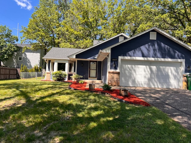 12310 Flintwood St NW, Coon Rapids, MN 55448 - view of front of home featuring a garage, driveway, brick siding, and a chimney