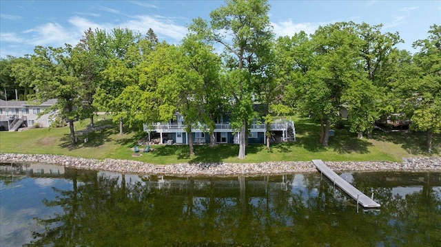18271 Emerson Trl, Burtrum, MN 56318 - dock area with a water view, a yard, and stairway