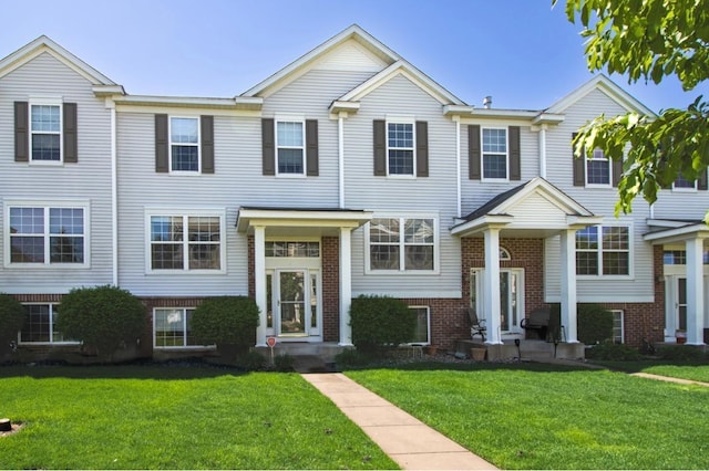 5150 Fairpoint Dr N, Hugo, MN 55038 - view of front of home with brick siding and a front yard
