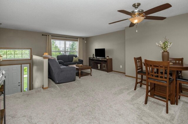 5150 Fairpoint Dr N, Hugo, MN 55038 - living area with carpet floors, a ceiling fan, and baseboards
