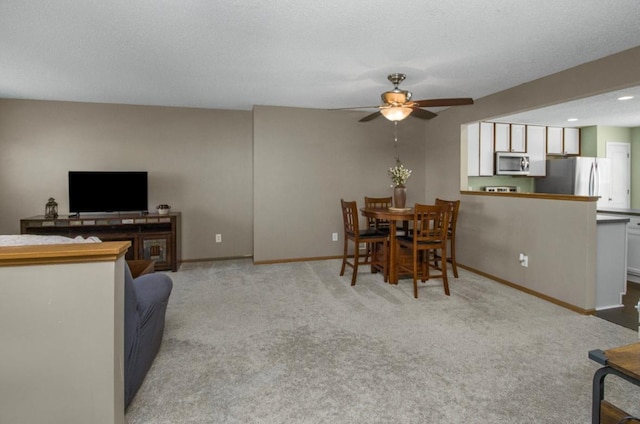 5150 Fairpoint Dr N, Hugo, MN 55038 - living room with a ceiling fan, carpet flooring, and baseboards