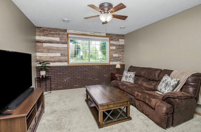5150 Fairpoint Dr N, Hugo, MN 55038 - carpeted living area featuring ceiling fan, brick wall, and wood walls