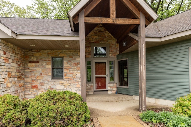 2373 Tee Time Rd SE, Rochester, MN 55904 - entrance to property featuring stone siding and a shingled roof