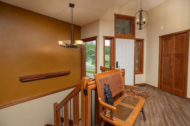 2373 Tee Time Rd SE, Rochester, MN 55904 - entryway with a chandelier, wood finished floors, baseboards, and high vaulted ceiling