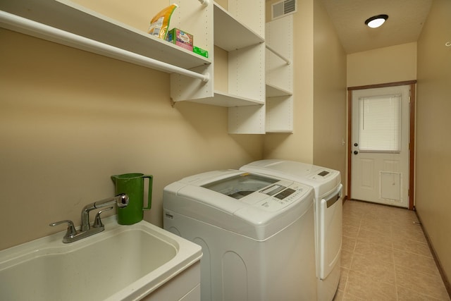 2373 Tee Time Rd SE, Rochester, MN 55904 - washroom with separate washer and dryer and light tile patterned flooring