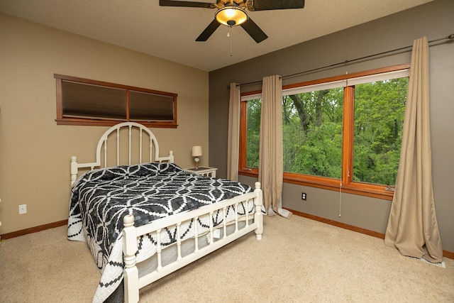 2373 Tee Time Rd SE, Rochester, MN 55904 - bedroom with carpet floors, baseboards, and a ceiling fan