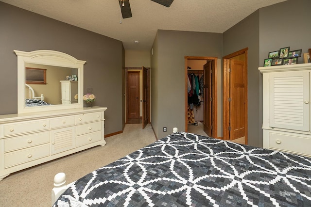 2373 Tee Time Rd SE, Rochester, MN 55904 - bedroom with light carpet, a walk in closet, a closet, and a ceiling fan