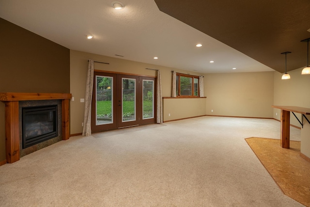 2373 Tee Time Rd SE, Rochester, MN 55904 - unfurnished living room with carpet flooring, baseboards, a tiled fireplace, and recessed lighting