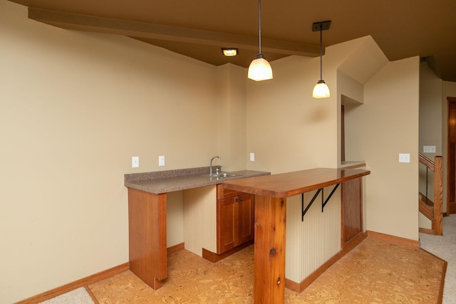 2373 Tee Time Rd SE, Rochester, MN 55904 - indoor wet bar featuring hanging light fixtures and baseboards