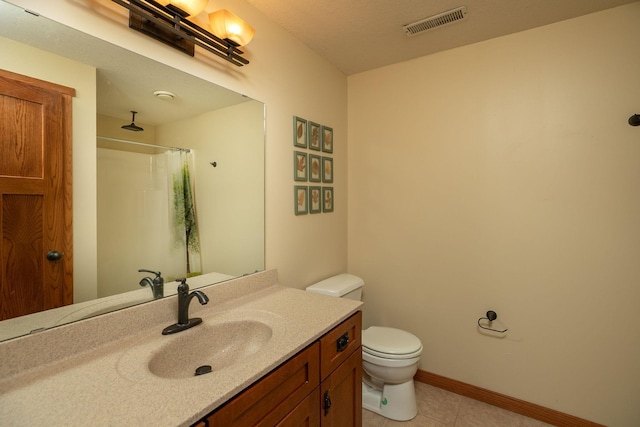 2373 Tee Time Rd SE, Rochester, MN 55904 - bathroom with toilet, vanity, tile patterned flooring, a shower with curtain, and baseboards