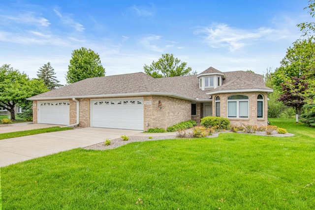 1263 Silverthorn Dr, Shoreview, MN 55126 - view of front of home featuring brick siding, a front yard, driveway, and an attached garage