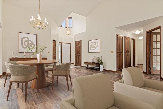 1263 Silverthorn Dr, Shoreview, MN 55126 - dining space featuring a chandelier, wood finished floors, baseboards, and high vaulted ceiling