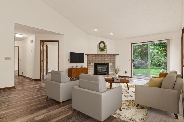1263 Silverthorn Dr, Shoreview, MN 55126 - living room featuring vaulted ceiling, wood finished floors, a fireplace, and baseboards