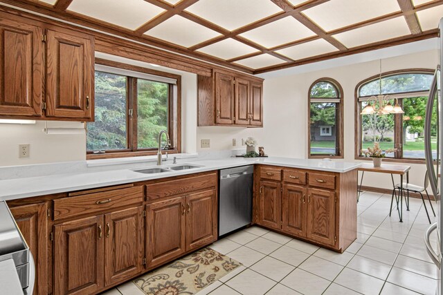 1263 Silverthorn Dr, Shoreview, MN 55126 - kitchen with stainless steel dishwasher, a sink, a peninsula, and brown cabinets