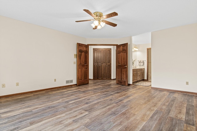 1263 Silverthorn Dr, Shoreview, MN 55126 - spare room with a ceiling fan, wood finished floors, and baseboards