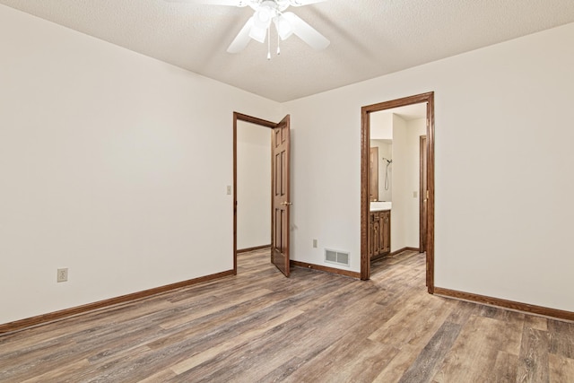 1263 Silverthorn Dr, Shoreview, MN 55126 - empty room with wood finished floors, ceiling fan, and baseboards