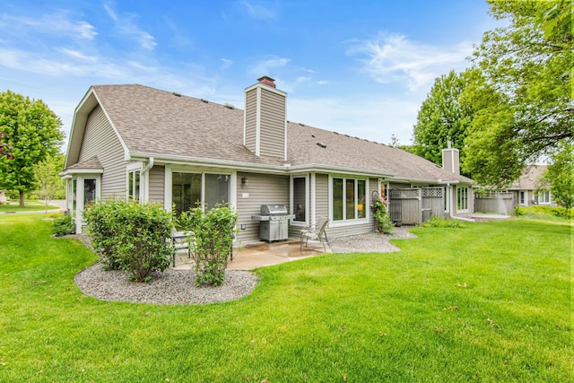 1263 Silverthorn Dr, Shoreview, MN 55126 - rear view of property with a chimney, a patio area, and a shingled roof