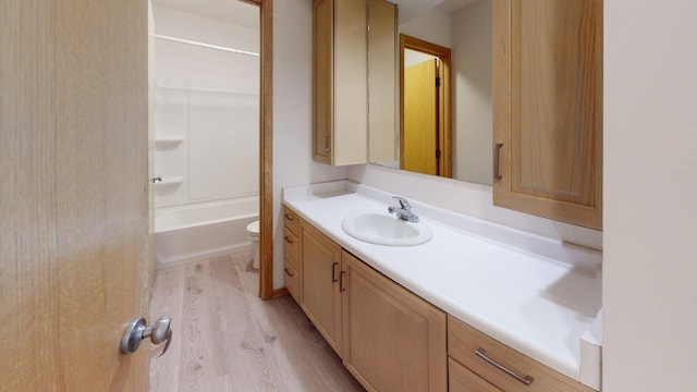 1904 Greenview Pl SW, Rochester, MN 55902 - full bathroom with vanity, wood finished floors, toilet, and  shower combination