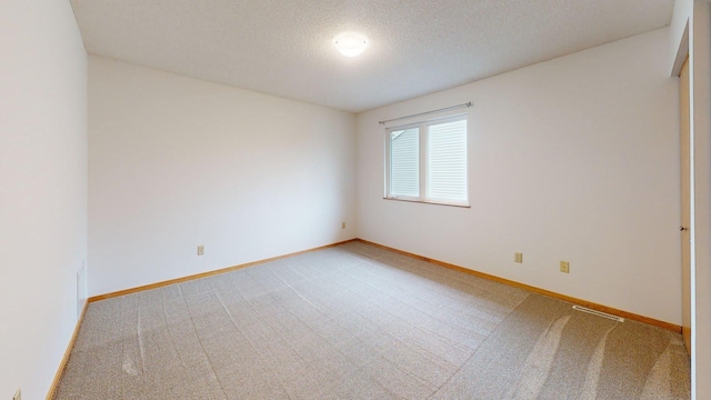 1904 Greenview Pl SW, Rochester, MN 55902 - carpeted spare room featuring baseboards and a textured ceiling